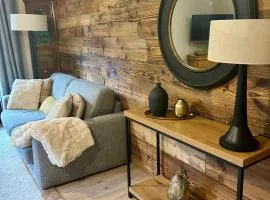 Appartement style chalet avec grande terrasse et parking prive