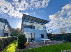 6pers Modern harbor house Jasmijn with fenced garden and lake view