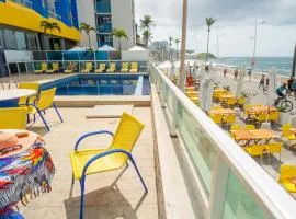 Pé na Areia - Flat com Piscina, Ar e Garagem na Barra