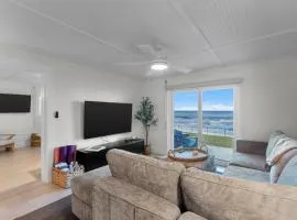 Sunrise Villa Renovated Ocean Front Condo Steps to Beach & Pool