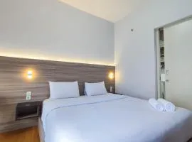 Comfort 1BR at Amartha View Apartment By Travelio