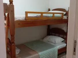 Wooden bunk bed in a dorm 5' from metro