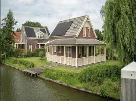 Bungalow by Water near Rotterdam with Sauna