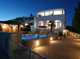Apartments Sun Dance 2 with heated Pool, homestay in Novalja