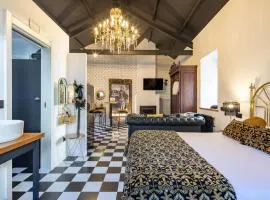 La Suite Años 20 Bañera, chimenea y terraza