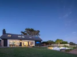 "La villa sur la baie" vue imprenable et piscine intérieure 29 degrés