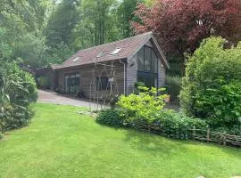 Woodside Lodge, surrounded by woodland and beautiful gardens