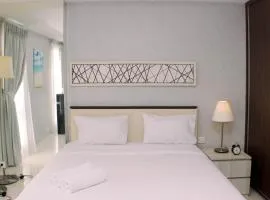 Big and Cozy Studio at Azalea Suites Apartment By Travelio