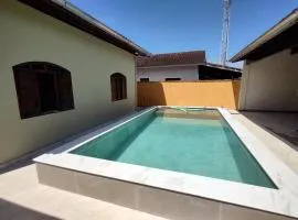 Casa piscina com ozônio churrasqueira perto da praia