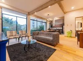 Modern Art Filled Home with Large Living Space and City Views