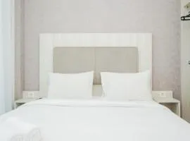 Comfy and Minimalist Studio Apartment at Tree Park City BSD By Travelio