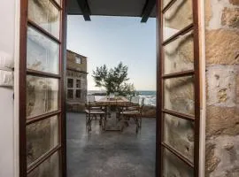 kito- transformed house on the water's edge
