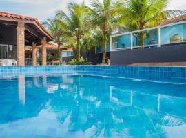 Casa com piscina aquecida, Condomínio a beira mar, khách sạn ở Bertioga