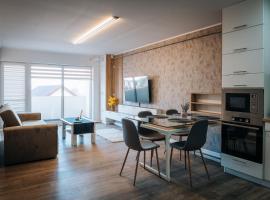 Apartament spațios cu magazin si bus, hotel din Baciu