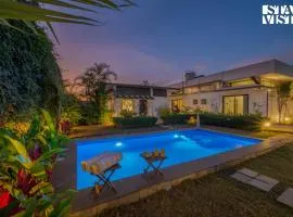 Serene Garden by VEO - Part of StayVista with Pool and Lawn area