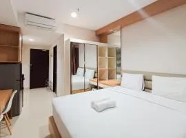 Homey Studio at Patraland Amarta Apartment By Travelio