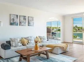 Stunning waterfront townhouse with shared swimpool, harbour view and free P