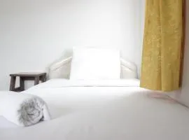 Spacious 2BR Apartment at Pinewood near JATOS By Travelio