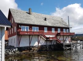 Charming sea house with sauna and private jetty, hotel in Ølve