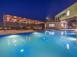 ELIVAAS Hidden Oasis 4BHK with Pool, Mud House & Container House, hotel in Dhauj
