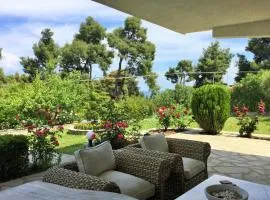 Green, White & Guest Houses by Dimitrios Ballas in Kriopigi, Halkidiki, Greece