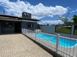 Casa com piscina capão da canoa