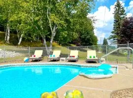Stylish Mountain View Chalet with Heated Pool, Large Hot Tub, Playroom & Firepit close to Gore Mountain