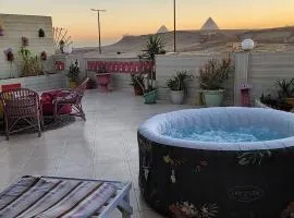 private rooftop with hot jacuzzi and pyramids view