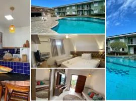 Flat frente praia de Taperapuã, atravessou a rua está na praia, com piscina, sauna e café da manhã como cortesia