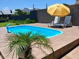 Casa ,piscina há 100 metros do mar ,24 pessoas
