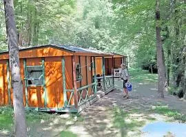 Bungalow confortable à Escaro avec piscine partagée