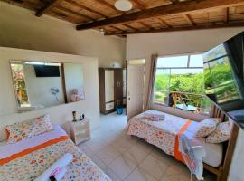 La Casa Del Gat0 Bungal0ws, hotel a Tumbes