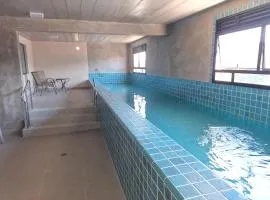 Studio entre Tenório e Praia grande, piscina aquecida