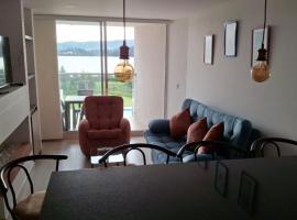 Apartamento con hermosa vista al lago, Hotel in Paipa
