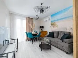 Eleganckie Apartamenty Blisko Plaży w Niechorzu z Klimatyzacją w Salonie i Parkingiem by Noclegi Renters