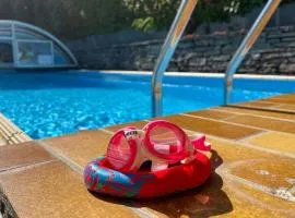 Sonnige Gartenwohnung mit Pool und Panoramasicht