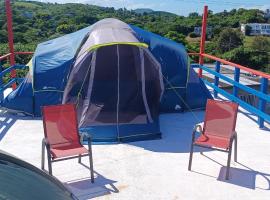Rooster Run Glamping Camping has rooftop and off the ground Glamping experience for 1 to 16 in a single tent and views of The Rain Forrest and to Culebra across the Atlantic Ocean w Tents, Linens, Deluxe Air Beds, Warm Shower and More at a Great Price, luxusní stan v destinaci Vieques