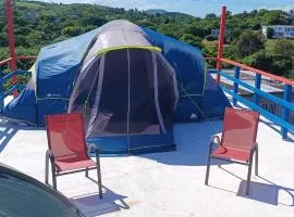 Rooster Run Glamping Camping has rooftop and off the ground Glamping experience for 1 to 16 in a single tent and views of The Rain Forrest and to Culebra across the Atlantic Ocean w Tents, Linens, Deluxe Air Beds, Warm Shower and More at a Great Price