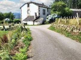 Charming house in Ourol with mountain view, large garden.