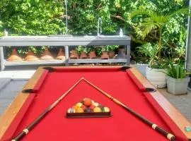 Bungalow charmant à Sainte-Rose avec piscine partagée