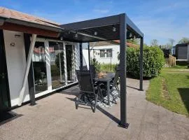 Bungalow in park with fenced garden