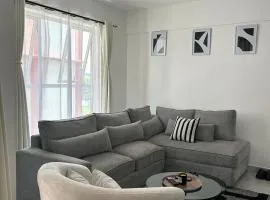 Secret Serenity - Modern, Stylish & Comfy 2 Bedroom Apartment With Workspace, Secure Parking, CCTV, Swimming Pool, Gym, And City Views in Nairobi