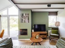 Grasmus I Kalme Woning met Openhaard en Tuin, hotel a Zwiggelte