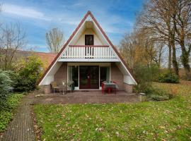 Heggenmus I Huisje met Haard in de Tuin, hotel in Zwiggelte