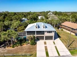 Canal home with pool, kayaks, private dock, firepit sleeps 9
