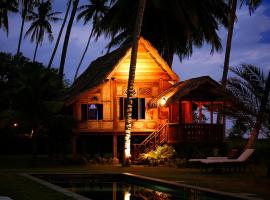 Bon Ton Antique Wooden Villas, hôtel à Pantai Cenang