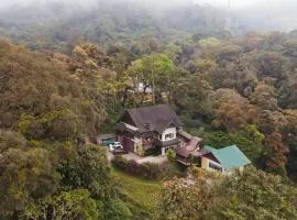 Nature Valley Farmhouse Resort by Raarees, Munnar #lap of nature #premium rooms #big parking #scenic view #garden with fireplace #property of the year