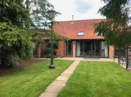 Barn with countryside views in private garden