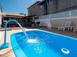 Casa confortavel com churrasqueira, rede e Wi-Fi