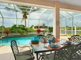 Tommy Bahama-style electric-heated pool home on Gulf-access canal - Villa Ellis